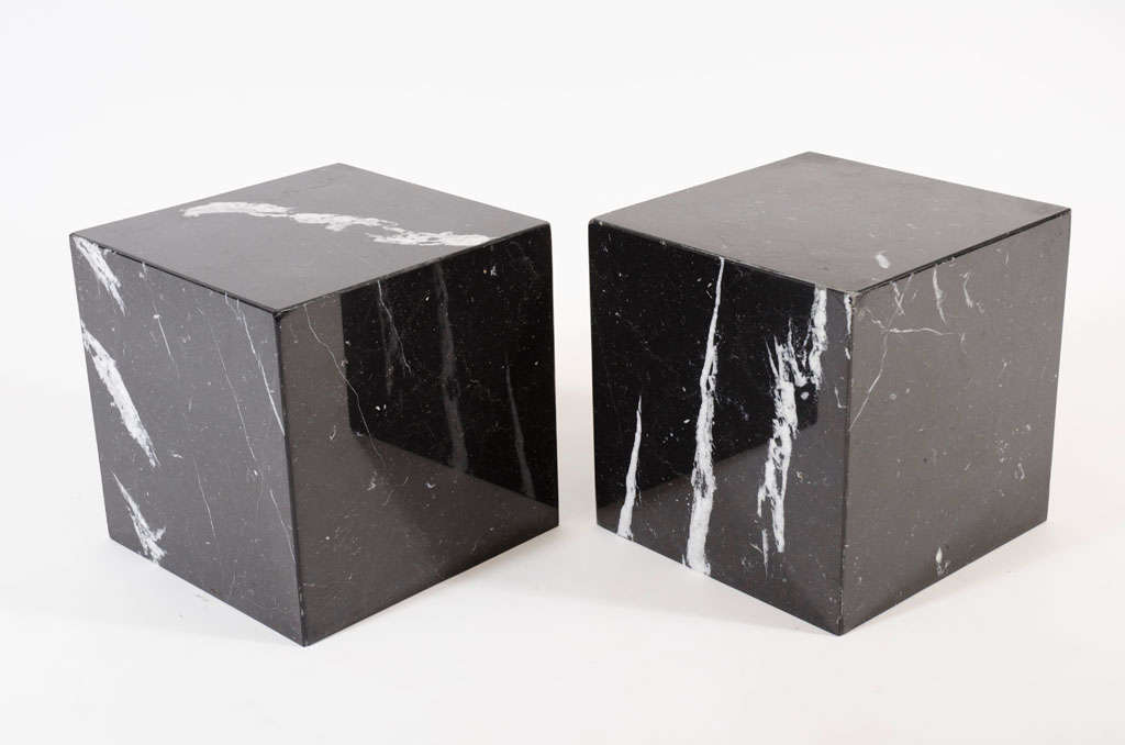 A chic pair of side tables in perfect hollow cube forms of negro Marquina Spanish marble. American, circa 1970's.