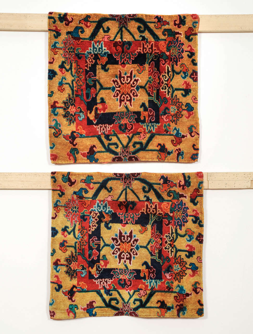 A possibly unique pair of silk meditation mats decorated by the so-called brocade square pattern, a design based on the patchwork of silk brocaded textiles. Here we see a pattern composed of three different brocade designs, framed by the pattern of