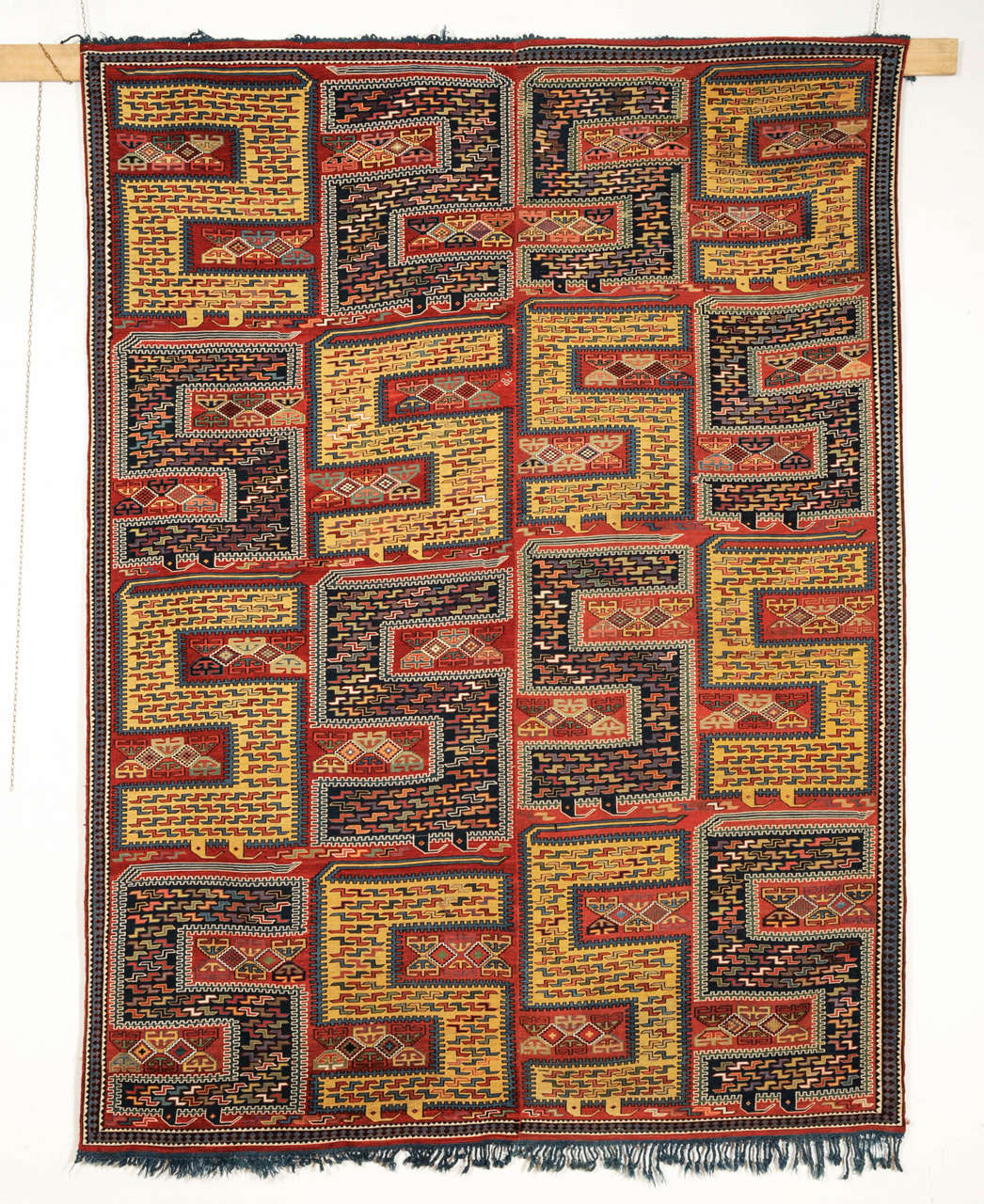 An antique Caucasian Sileh flat-woven carpet, embroidered in the 'Sumak' technique, distinguished by an all-over pattern of large, stylized dragon motifs. What makes this piece rather unique is the use of a brilliant yellow instead of ivory for the