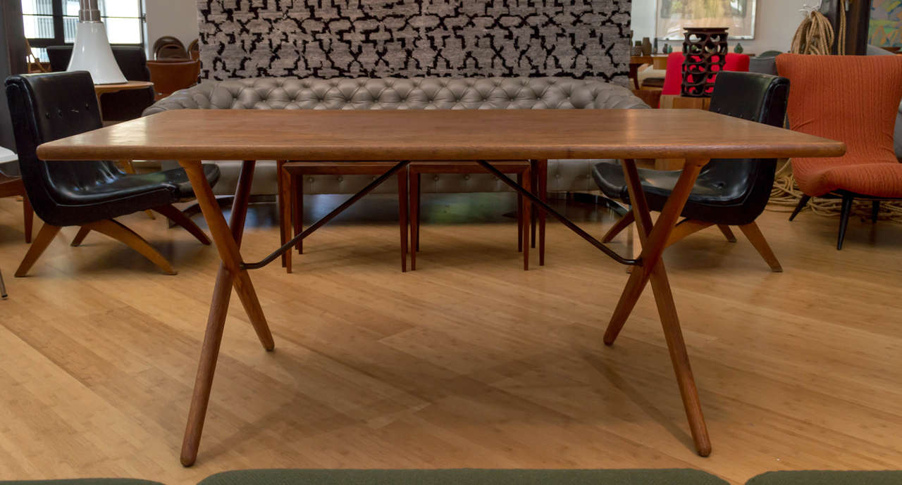 A teak table by Hans Wegner and manufactured by Andreas Tuck. Model AT303-A, the Cross Leg Table.