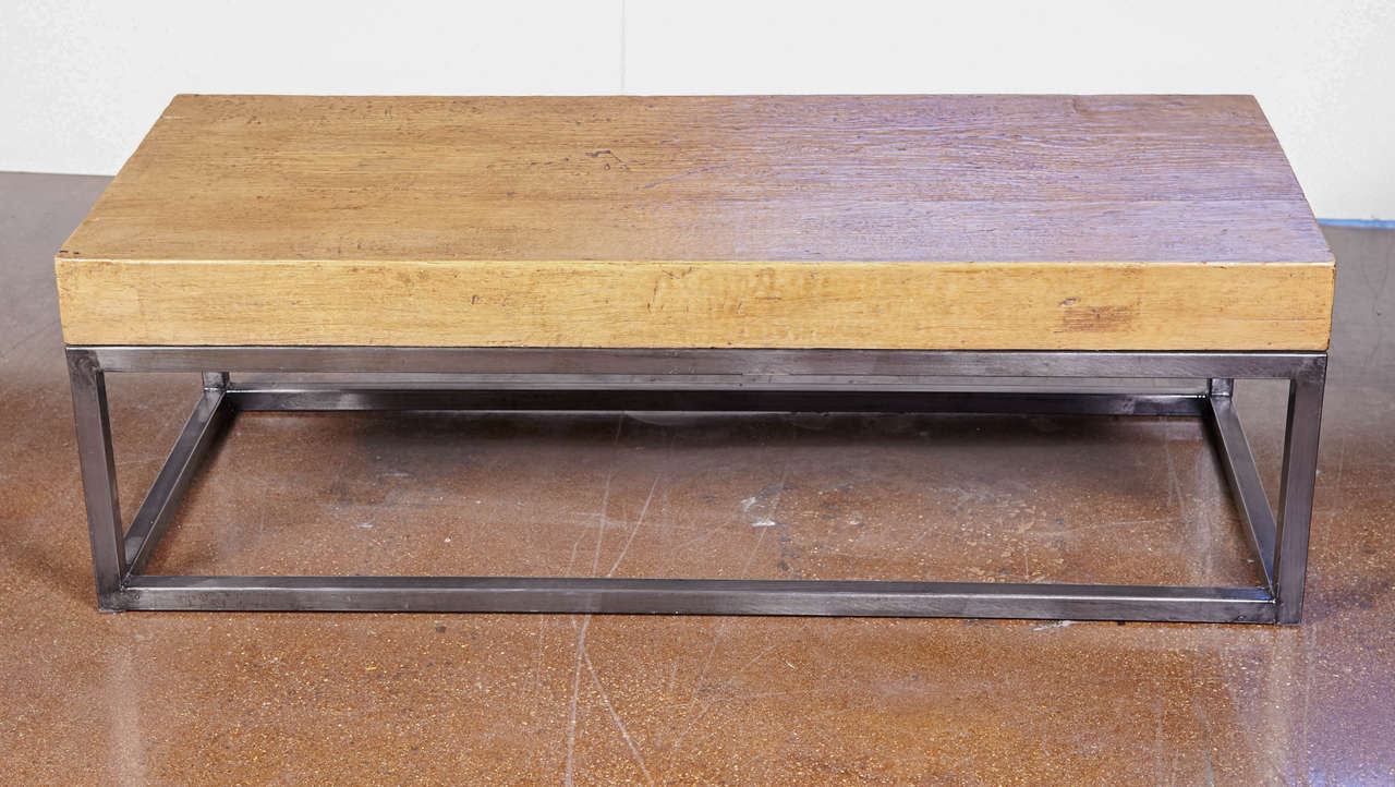 Reclaimed elm top coffee table on metal base.