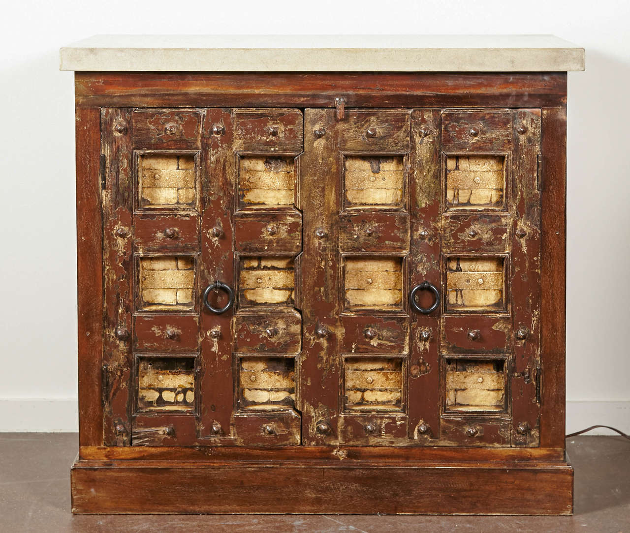 British Colonial, two door black style cabinet with limestone top.