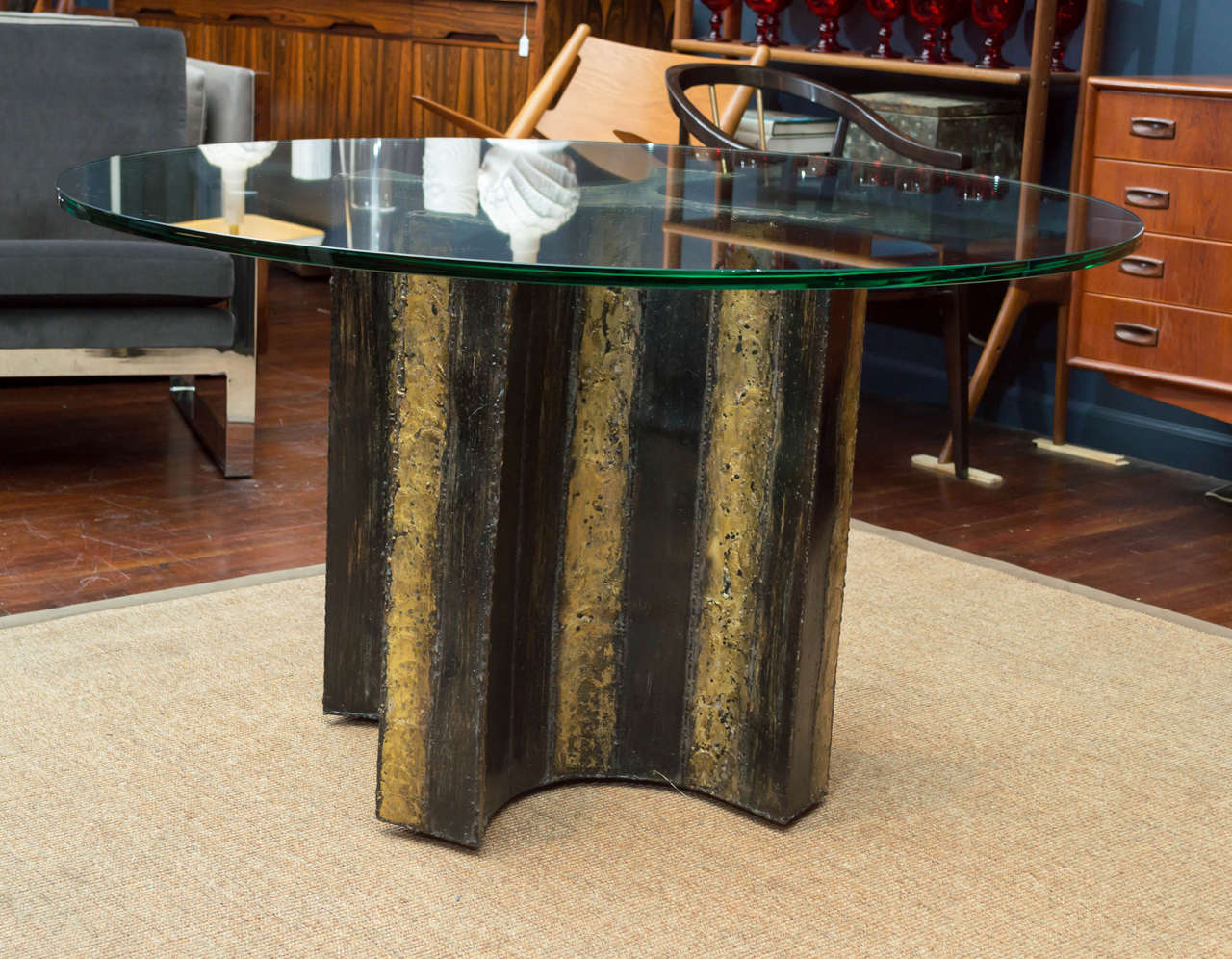 Rare and beautiful Paul Evans design dining table made from welded steel with braised brass decoration. 
Table base can support a larger glass top up to 6 foot diameter. 
Signed and dated.