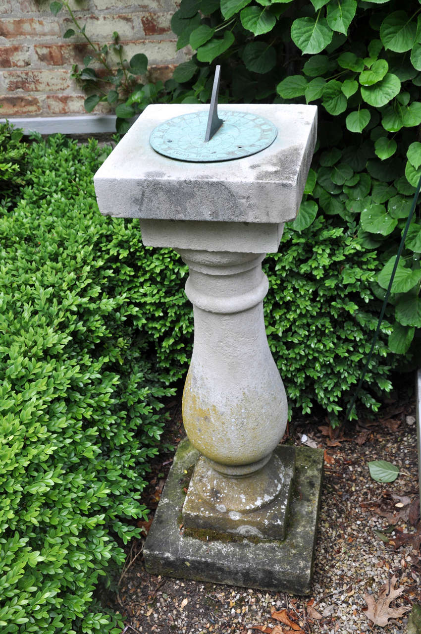 Nice weathered finish limestone base with bronze dial English, circa 1900.