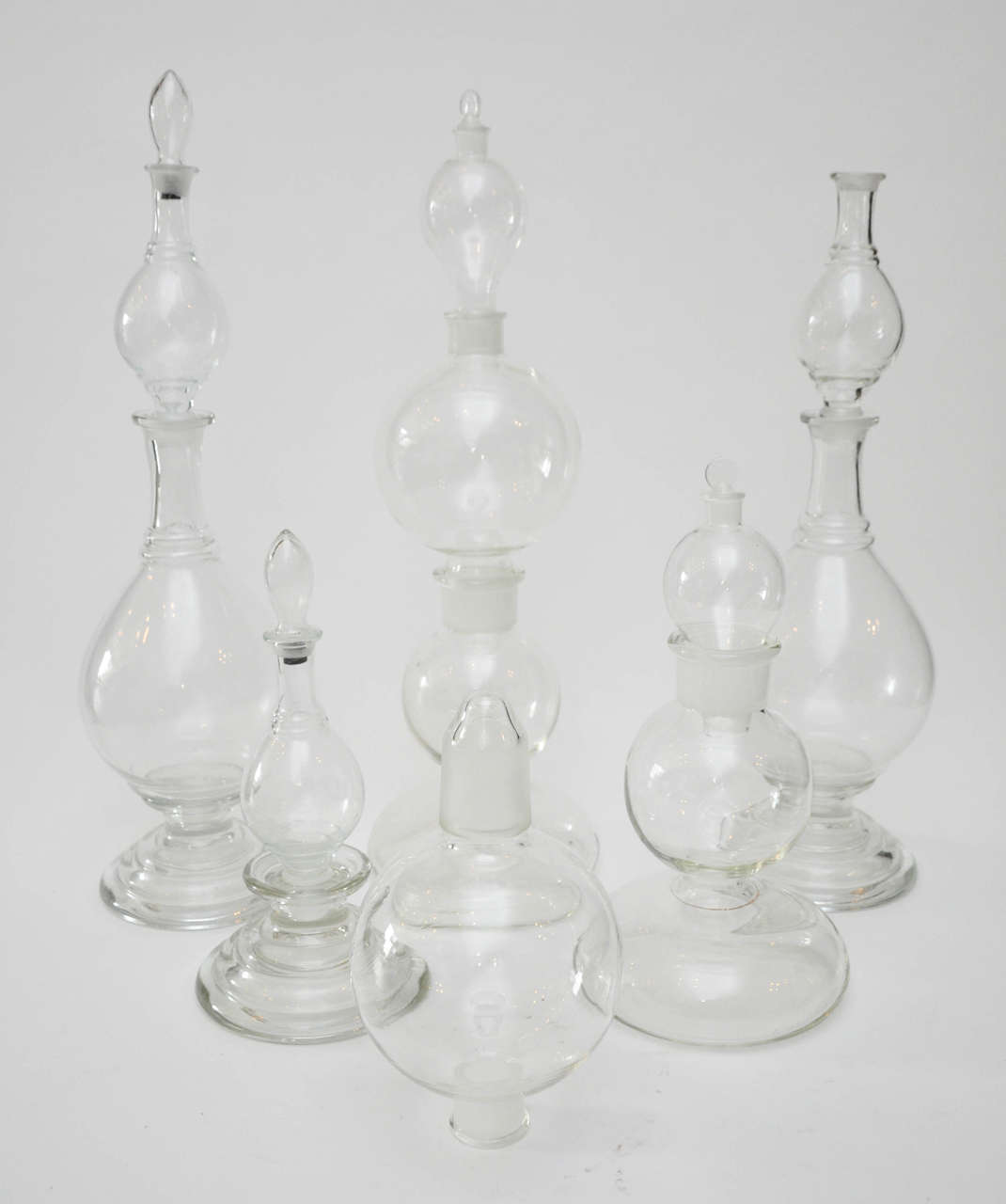 Glass vessels and tops, can be arranged in various groupings to create three to six separate vessels