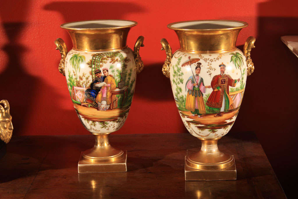 Porcelain and gilt urns. No marks on porcelain, painted couples in traditional Chinese dress.

OFFERED AT THIS 50% OFF PRICE FOR 2015 ONLY!