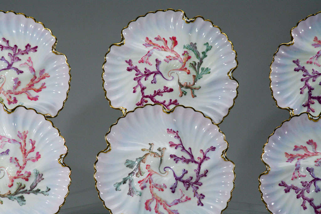 Wonderful rare set of six "Aesthetic Movement" hand-painted oyster plates, made by Spode and retailed by Tiffany and Company. The fabulous shaded soft pink ground shaded to lavender with gold trim and polychrome enamel decoration over
