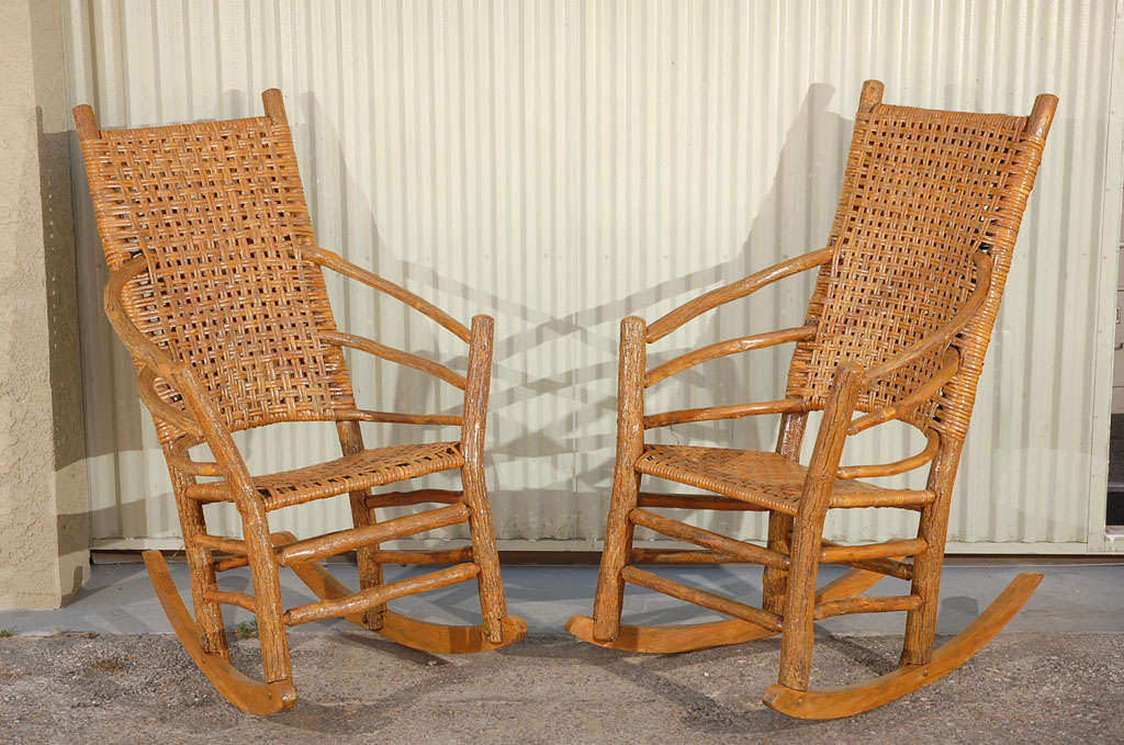 VERY RARE FORM EARLY 20THC SIGNED OLD HICKORY ROCKING CHAIRS.THIS WONDERFUL HIGH BACK MATCHING PAIR OF ROCKING CHAIRS HAS THE ORIGINAL OLD CANE SEATS AND BACKS.THE PAIR HAVE A NEWER VARNISH OVER THE OLD PAINTED SURFACE.THEY HAVE BEEN FULLY RESTORED