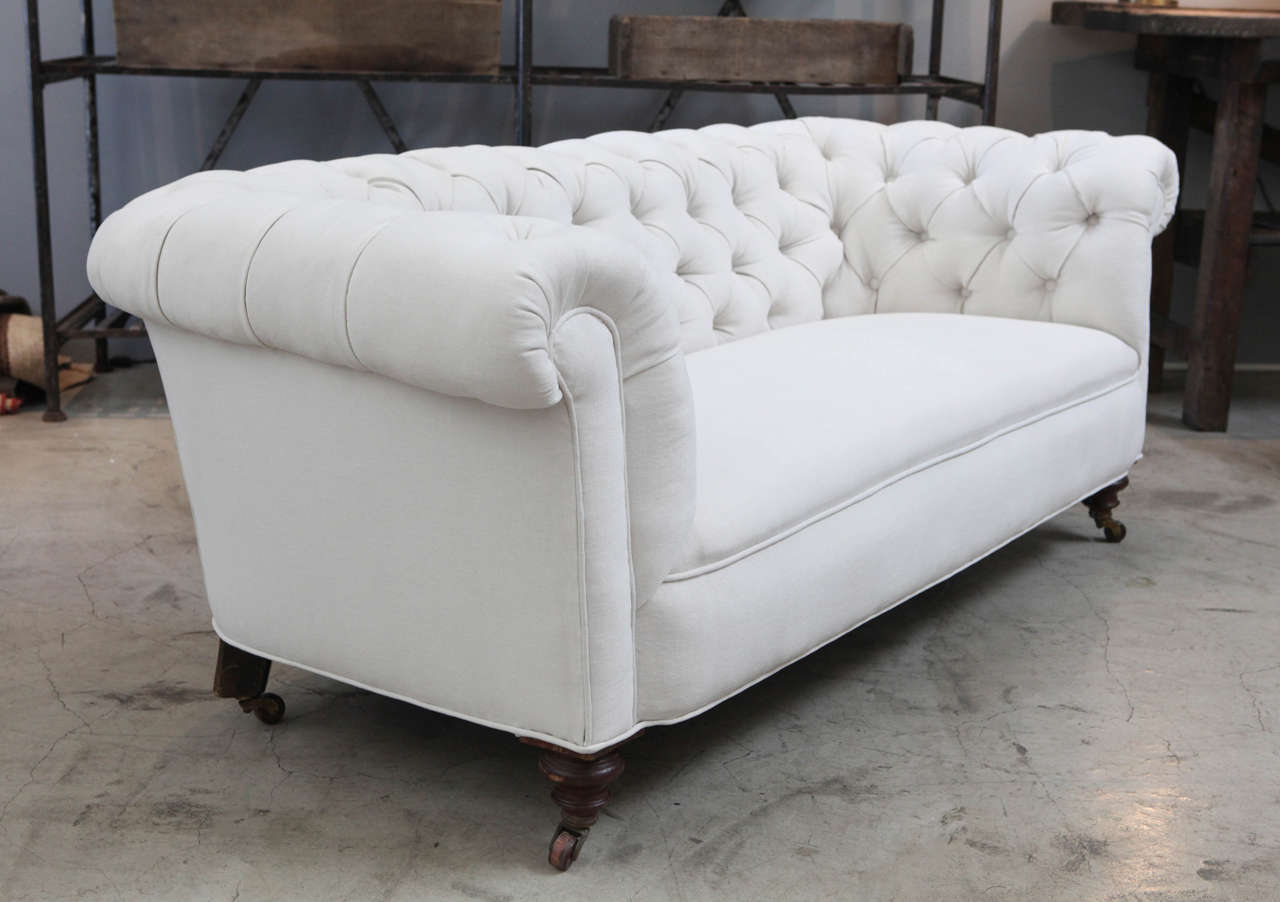 newly upholstered in belgian off-white linen. with it's original mahogany frame and vintage charm.
