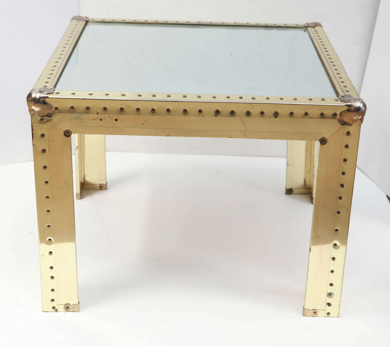 1970s modernist brass side table with nailhead detailing.