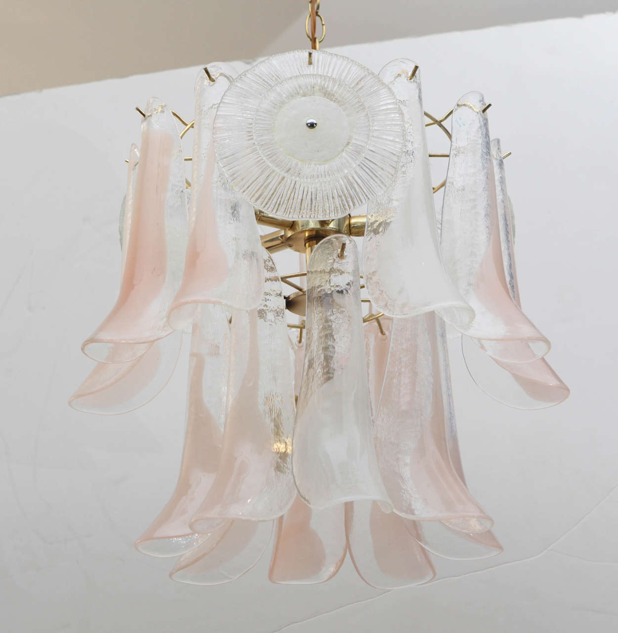 Pale pink Murano glass petals and off-white disks adorn a brass skeleton creating the graceful silhouette of this 1960s Italian chandelier.