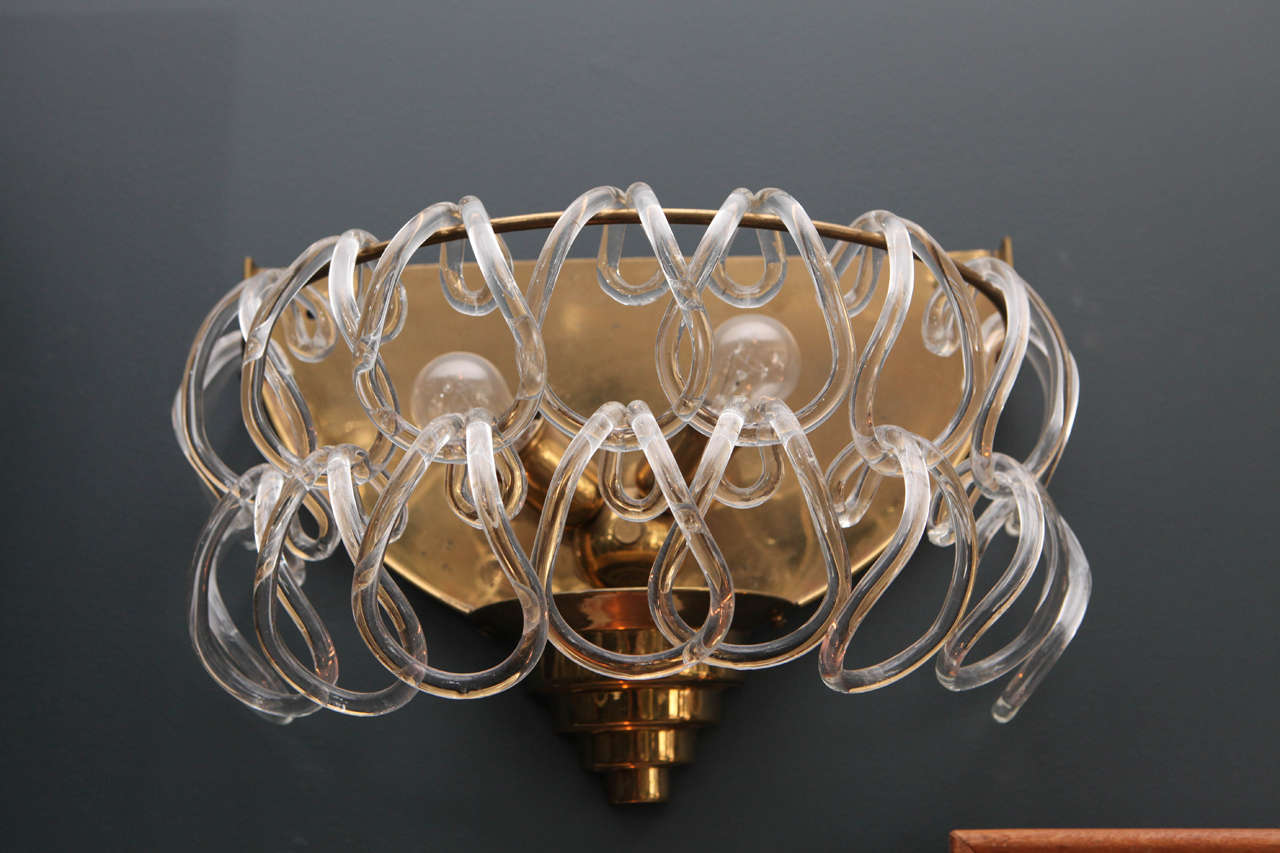 Pair of Art Deco brass sconces adorned with handblown glass links.