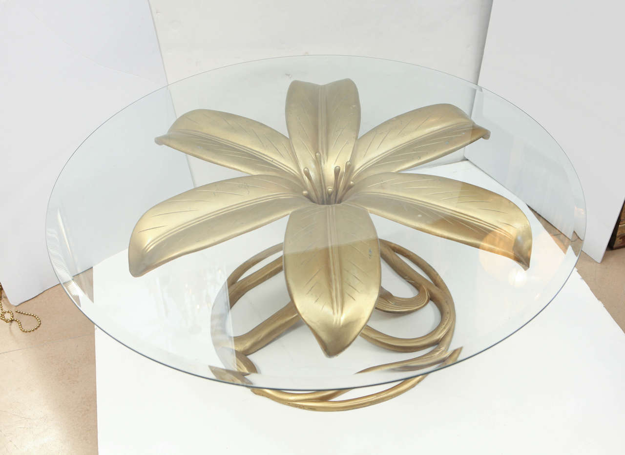 Arthur Court gilded gold lily coffee table with glass top.
