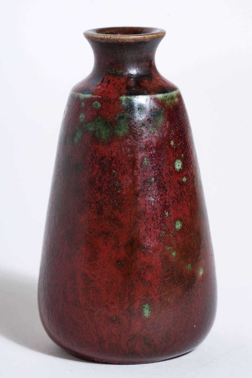 Sang de boeuf vase with green inclusions. 
Signed H. Sim in enamel.

(Price shown is reduced price, no further trade discount) 