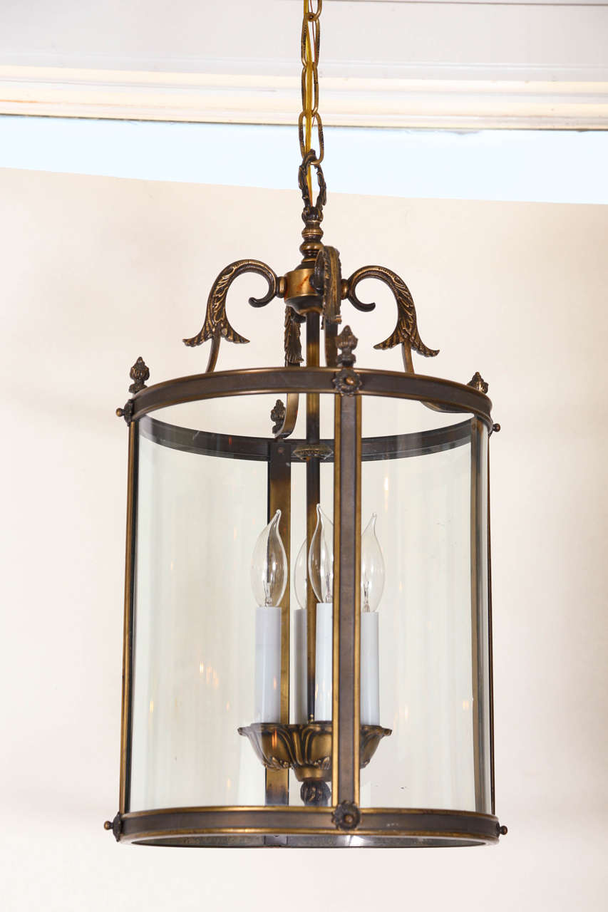 Vintage hanging lantern of brass and curved glass. Newly polished and rewired.