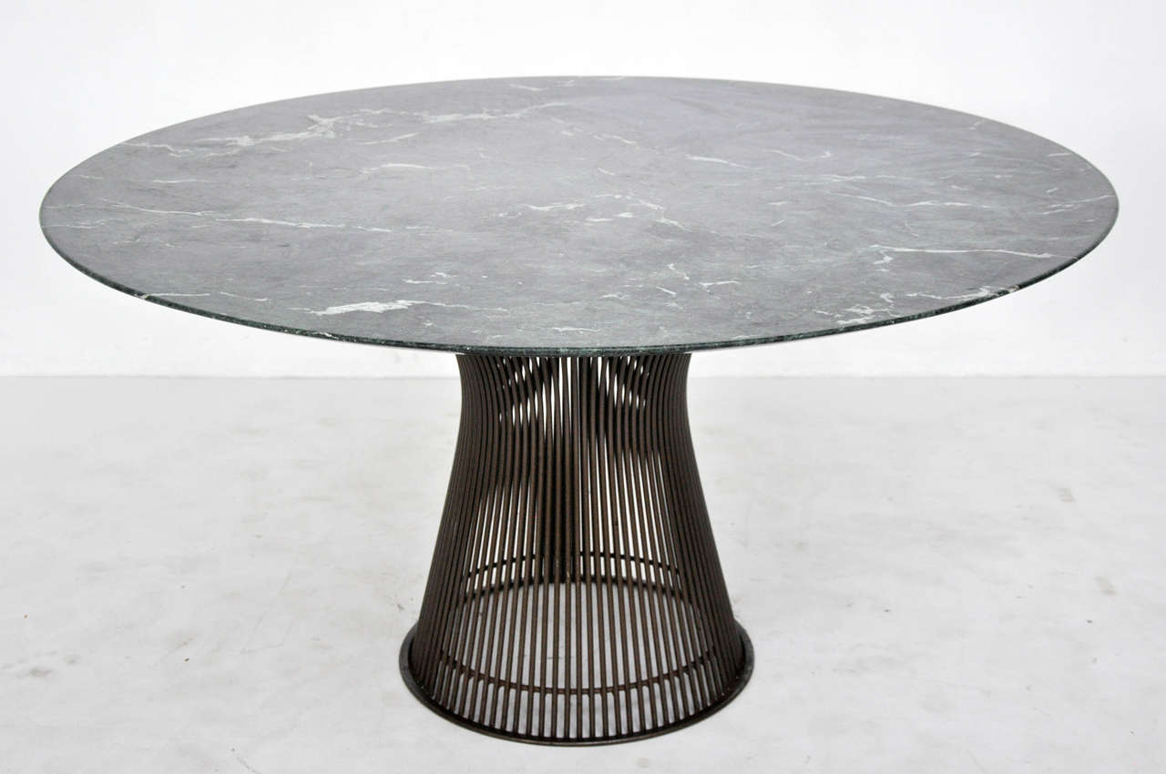 Dining table designed by Warren Platner for Knoll.  Bronze base with green marble top.