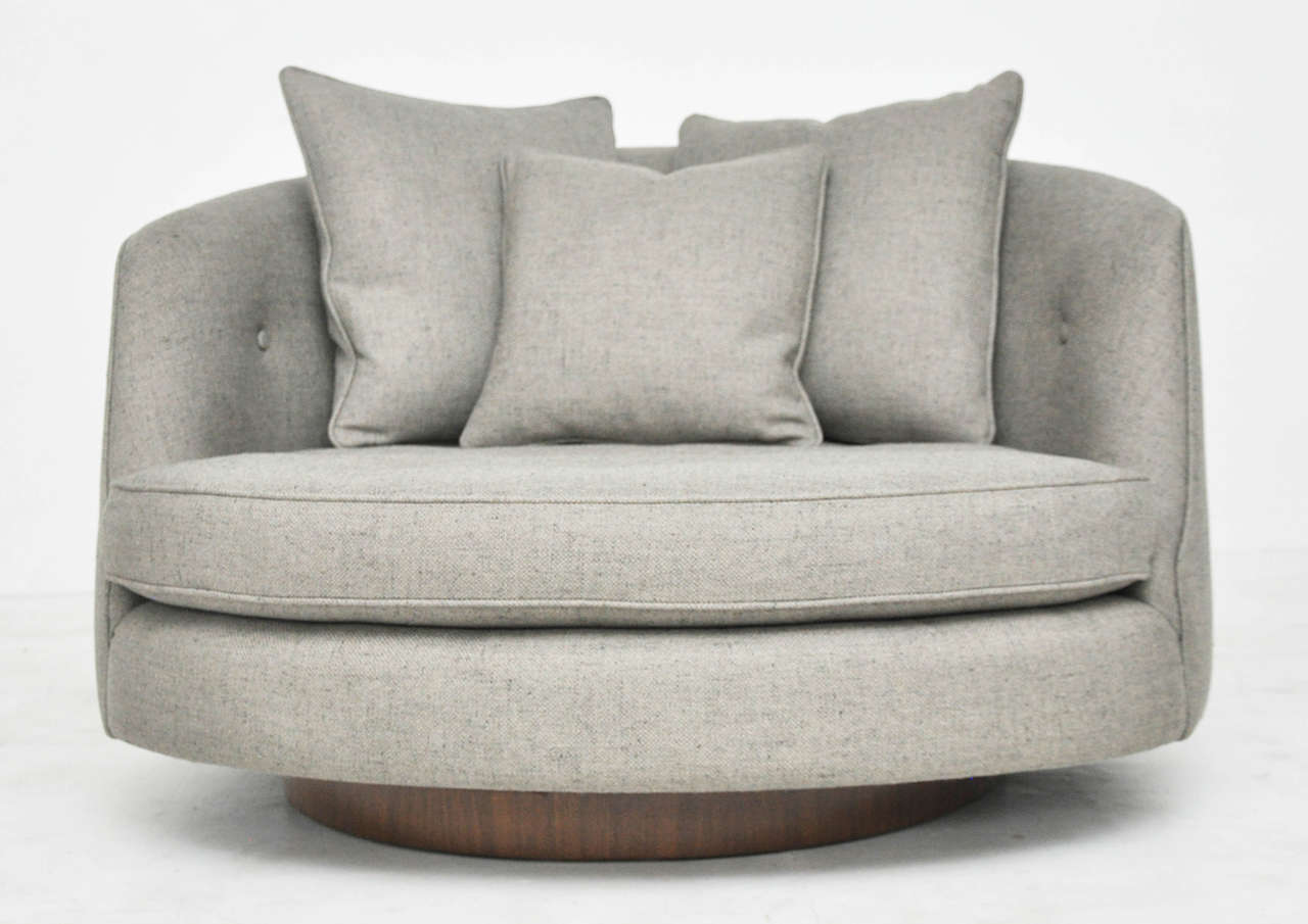 Large cuddle chair by Milo Baughman. Newly upholstered with fully restored walnut base.