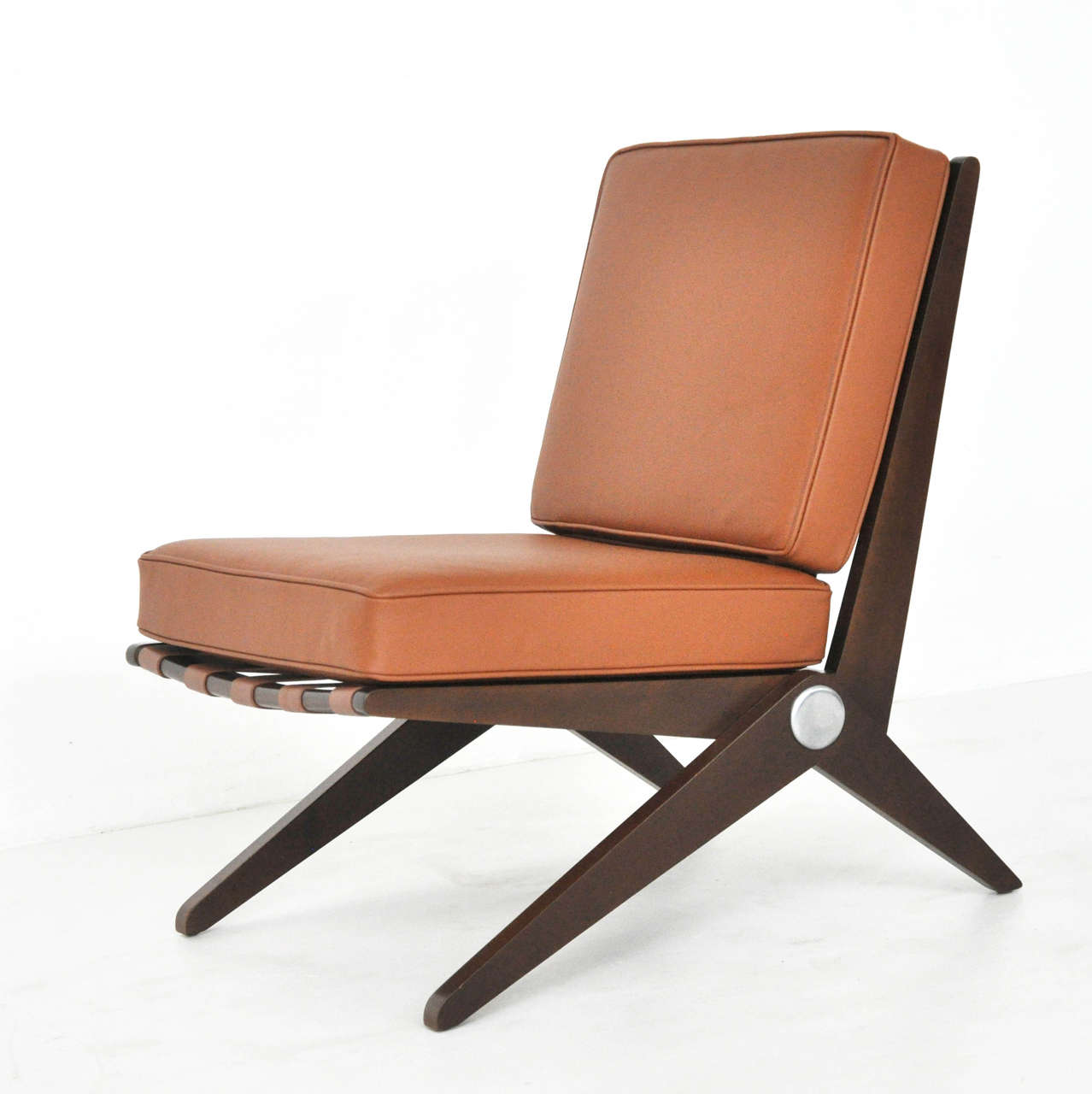 Scissor chair designed by Pierre Jeanneret for Knoll.  New leather straps and cushions over refinished base.  Fully restored.