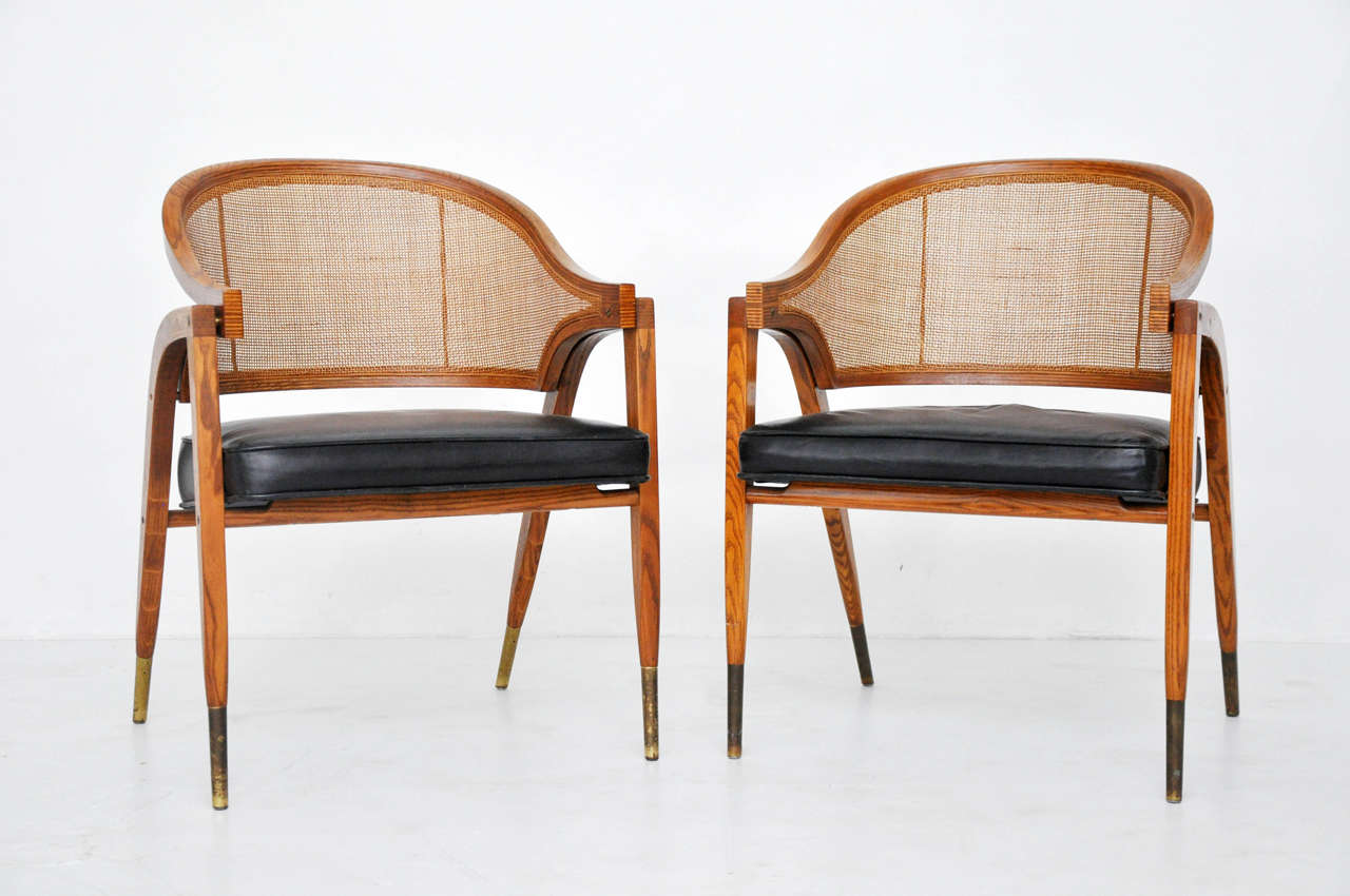 Sculptural form pair of arm chairs designed by Edward Wormley for Dunbar. Fully restored.