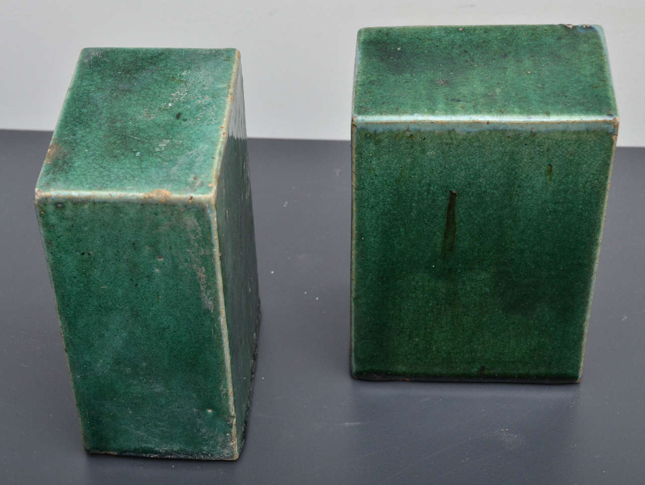 Pair of green ceramic rectangular decorative objects. They have a beautiful textural and bright green glazing to them.