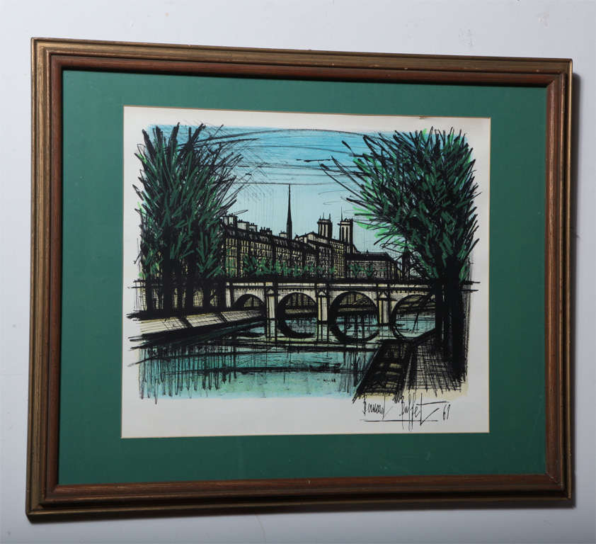 1968 Bernard Buffet original vintage framed print. Featuring a colorful French city scape including buildings, river, bridge and plantings in vibrant blue and green hues. Plate signed 1968.