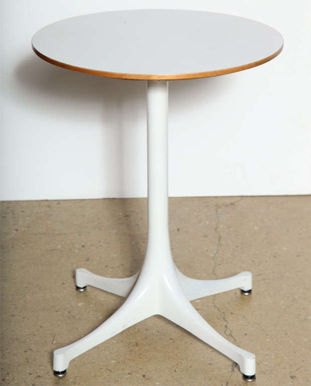 Classic. Vintage. George Nelson for Herman Miller 5451 Side Table. Featuring a round White Micarta Top with wood trim on White enameled Aluminum Swag Leg base. Compact. Small footprint. Multi-purpose. Sofa Table. Tablet. Plants. TV. Nightstand.