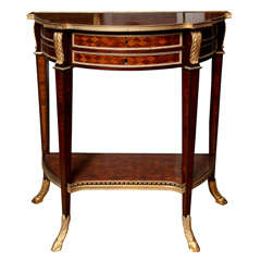 A two tiered French Louis XVI style mahogany marquetry inlaid side table