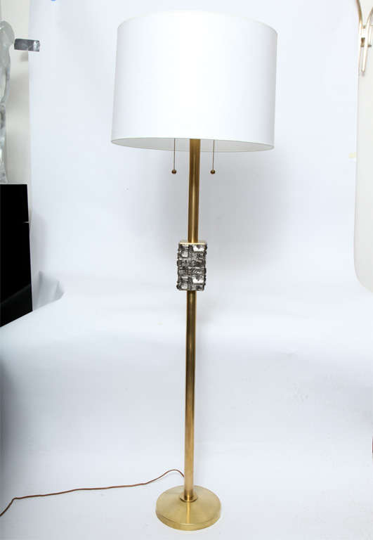 A pair of 1960s architectural brass and silver floor lamps.
Shades not included