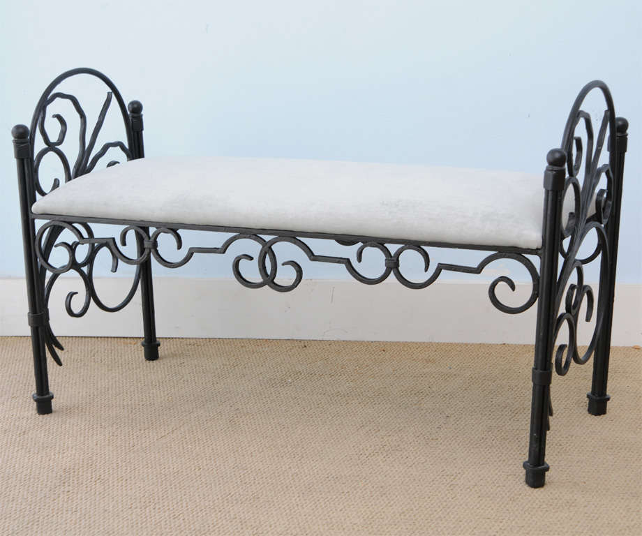 Beautifully 1940,s hand crafted wrought iron bench with painted fin. And upholstered seat cushion