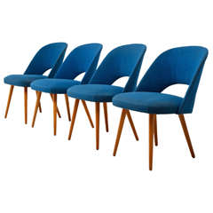 A set of four mid century modern chairs made by Thonet.