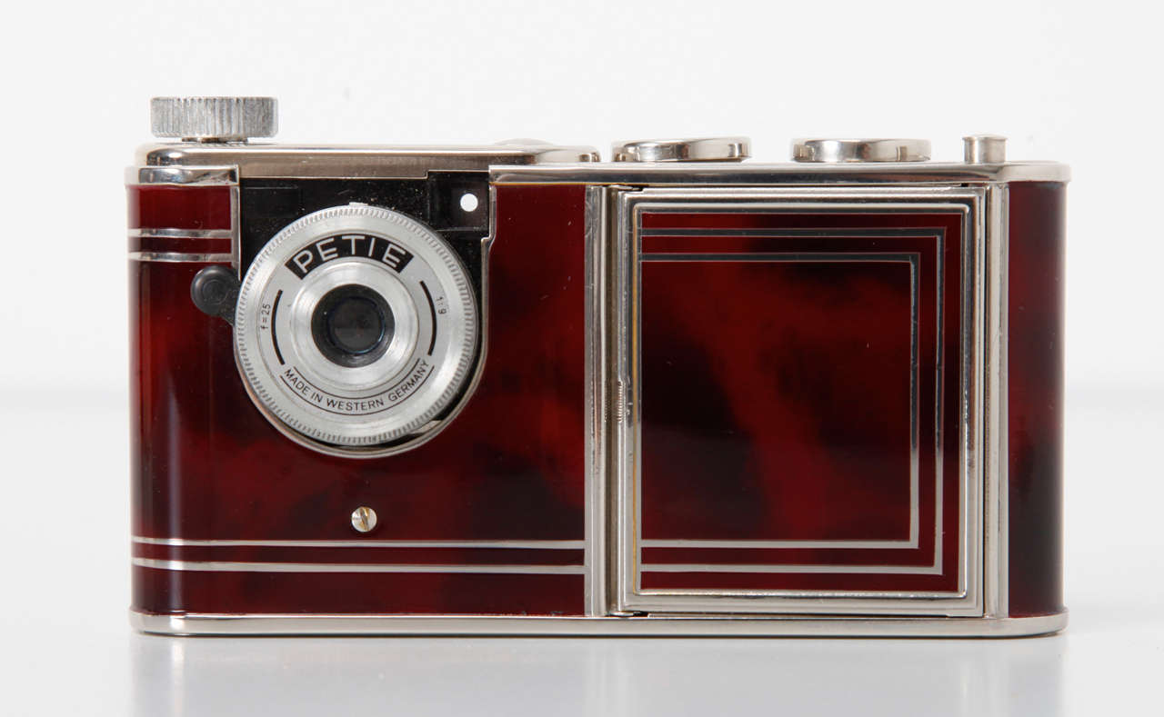 c1956. 16mm film, sub-miniature camera for 14x14 exposures. Camera inserted into a 