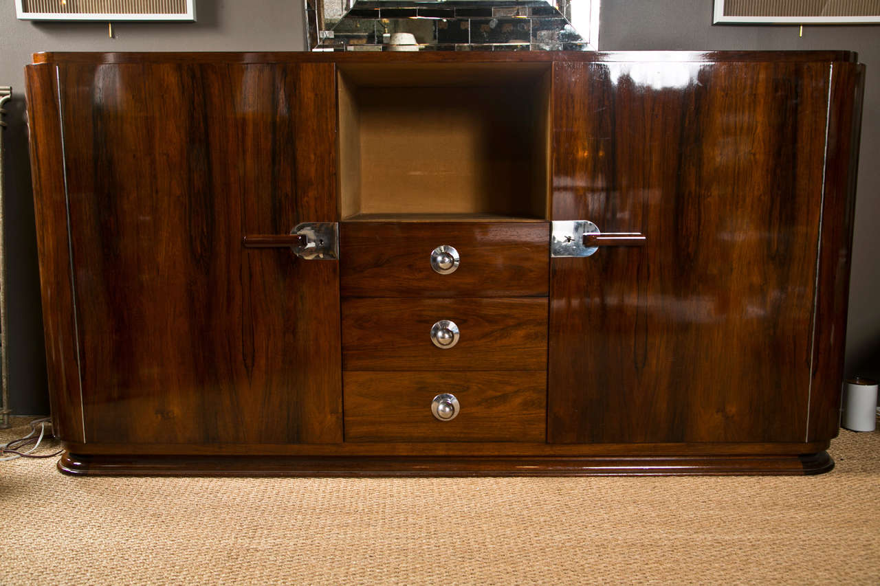 Large Art Deco rosewood side-cabinet with doors flanking the center section with 3 drawers and upper display cabinet.