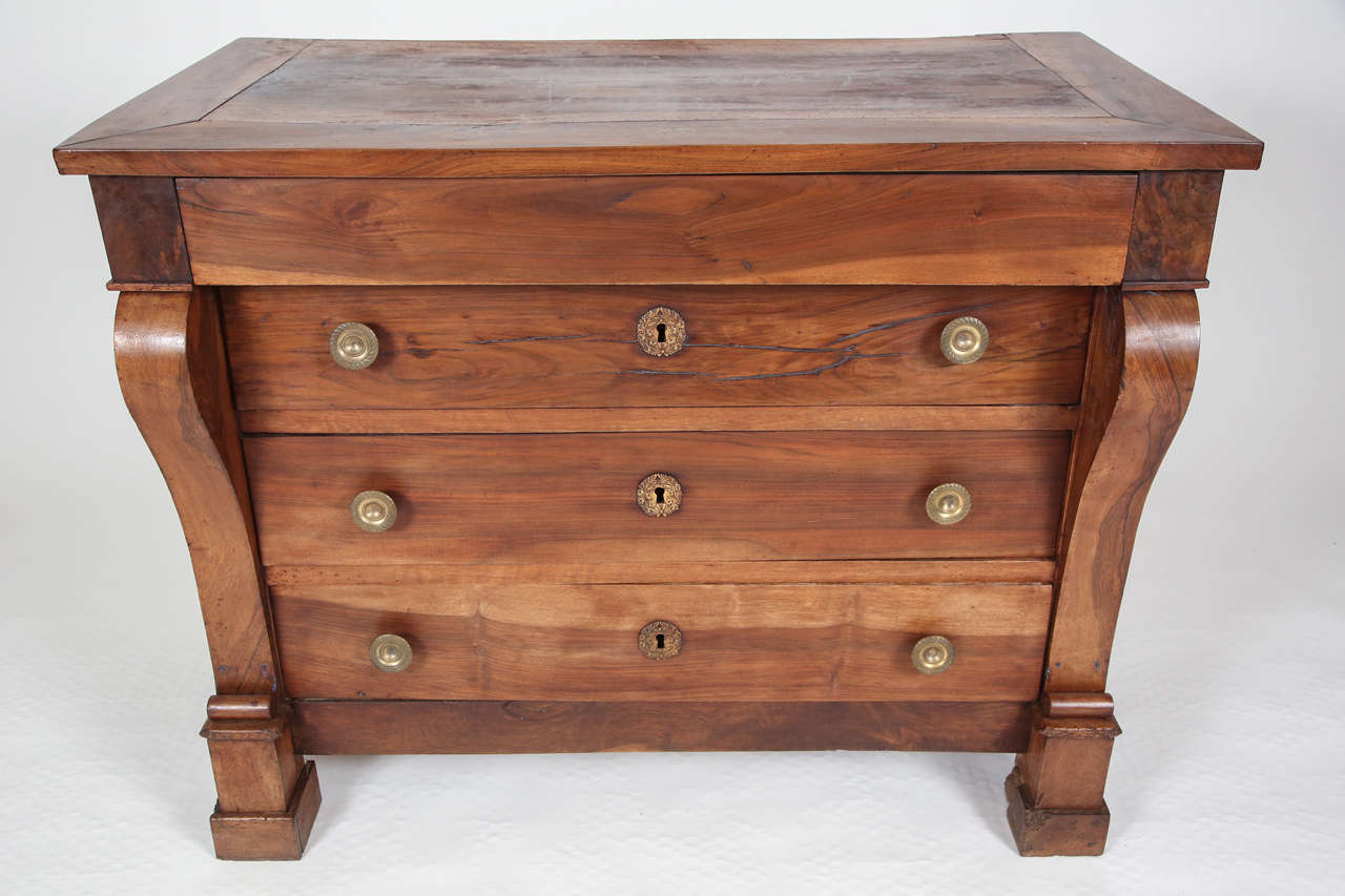 Fine walnut commode created in Toulouse, France during the 1820's. Restauration Style case piece has 4 drawers with metal hardware and keyholes the lower 3 drawers. Oil rubbed finish. 43
