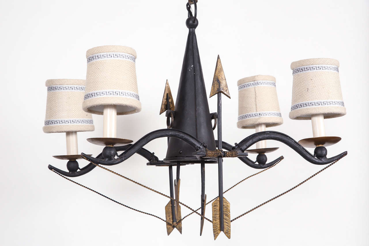 Black metal chandelier with gold gilt arrow and rope accents.  Newly wired 4-light chandelier holds candelabra-base bulbs.  Height is without chain, but chain is included.  21