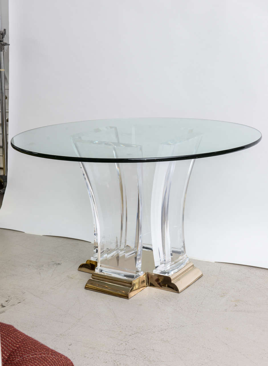 Art Deco inspired Lucite, brass and glass top dining table designed by Jeffrey Bigelow.