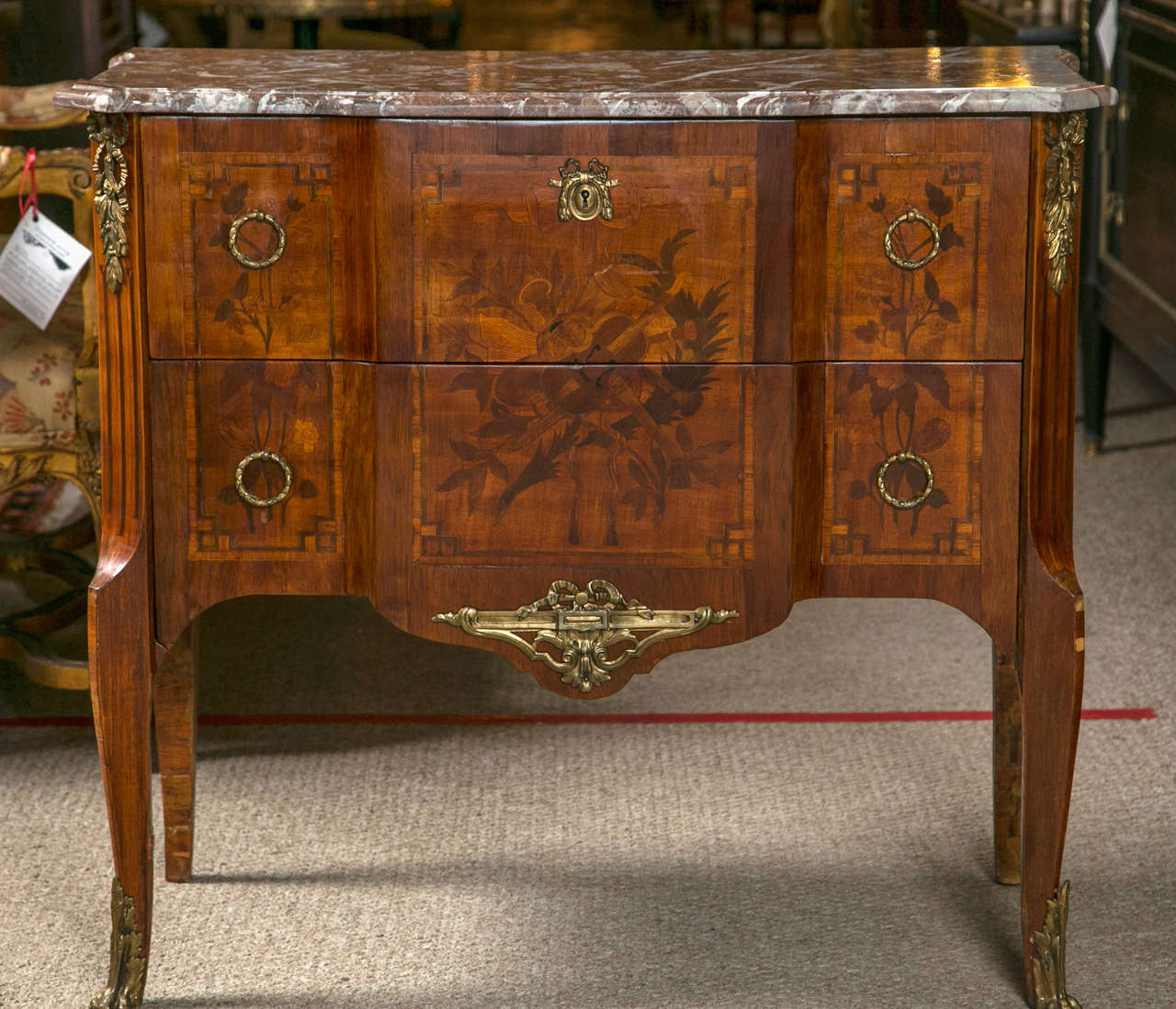 Pair of late 19th or early 20th century Louis XV style transitional commodes each stamped under the marble 
