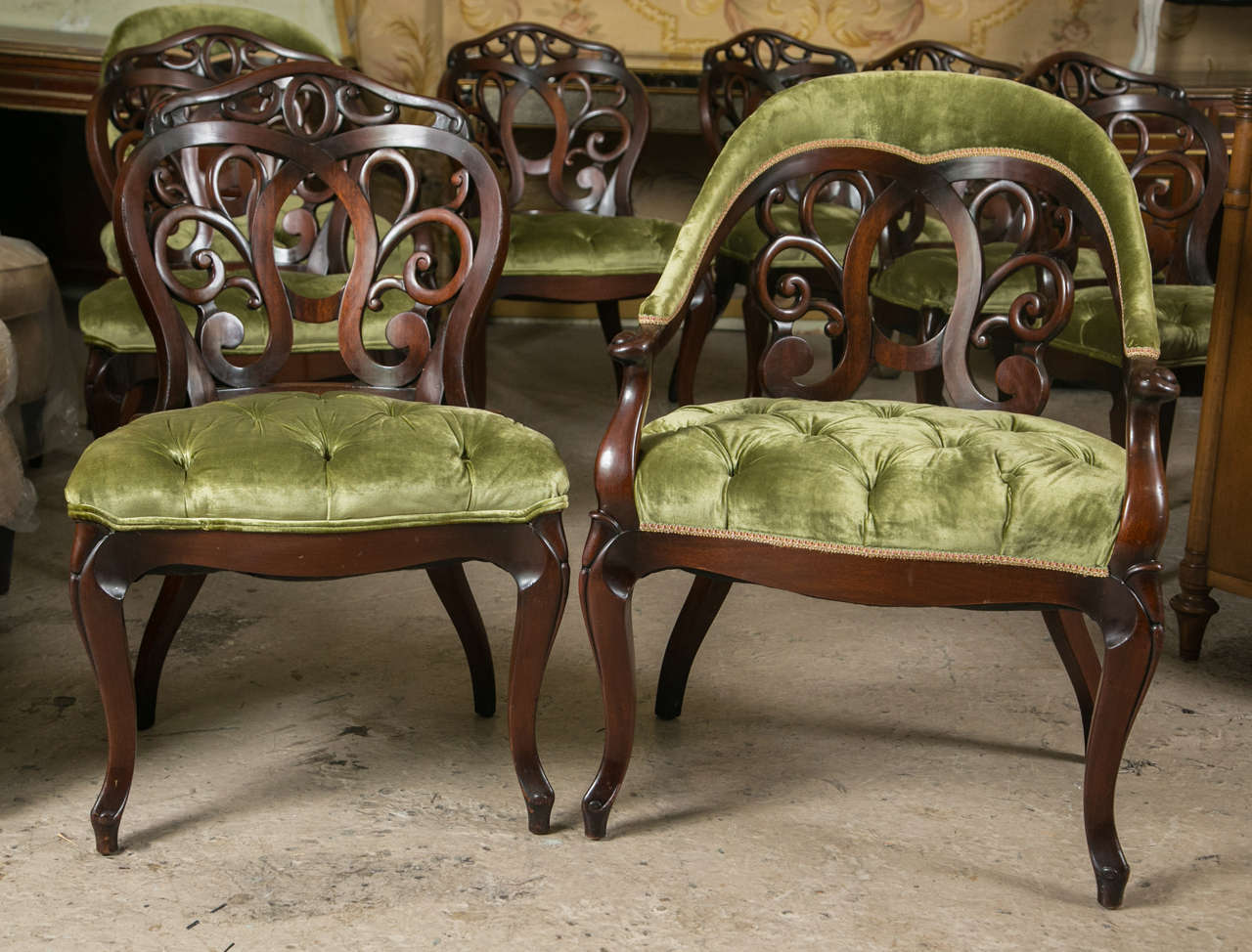 A fine set of solid mahogany dining chairs by J. Zonon Custom Furniture makers of NYC, circa 1940s. This set comprises a pair of arm and six side chairs. All having an olive green velour upholstery. The overall shape indicative of the Zonon style of
