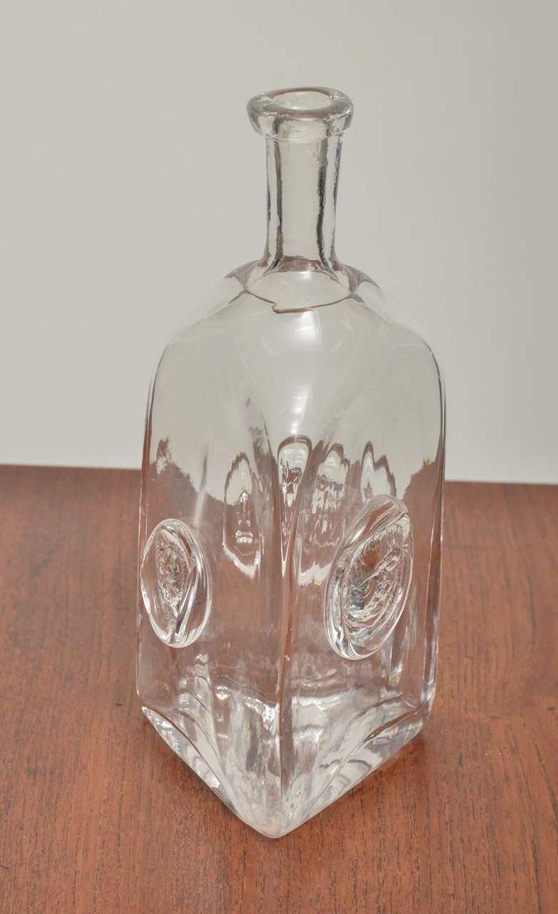 Swedish Clear Crystal Decanter with applied Relief Ornament:  Spirit Head, Portrait of his Glass Blower and mythic Beast - all Designed by Hoglund.   Circa 1960.