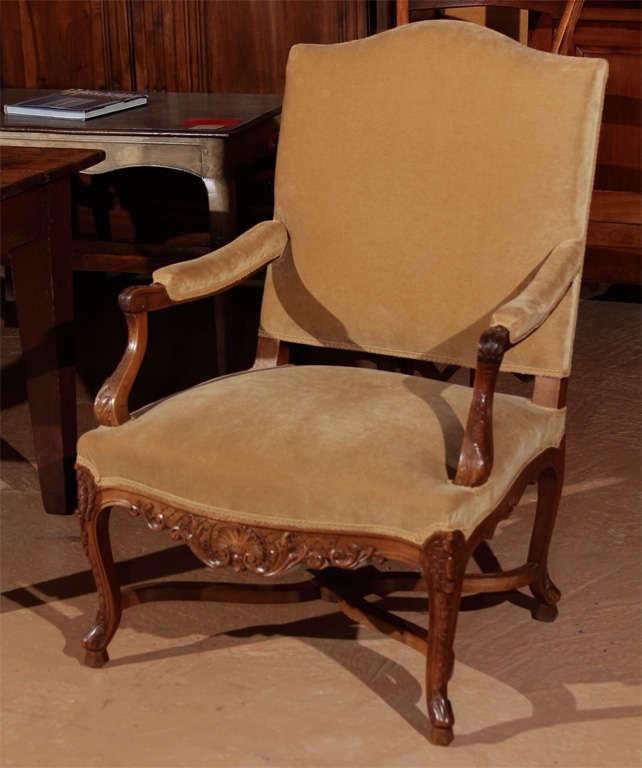 French Regency Style Armchair

This is a nice large size, French chair in the Regence style. It is beautifully carved along the arms and down the legs and across the apron.

This chair is covered in a tan mohair fabric (new).  

Wonderful