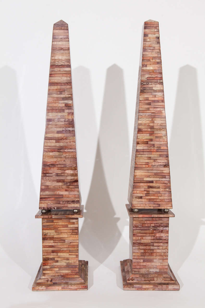 A striking pair of large-scale lacquered razor clam shell tessellated obelisks that are attributed to Maitland Smith.