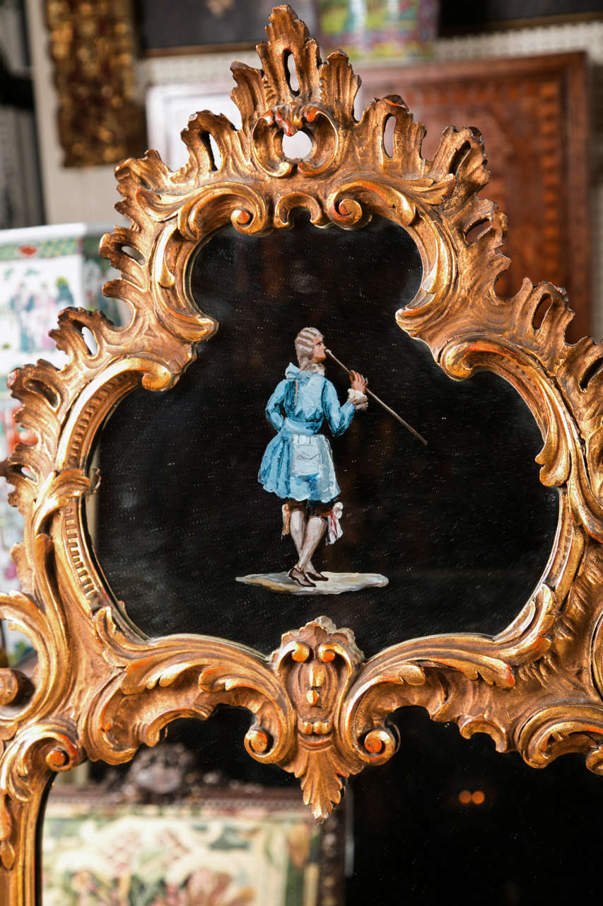 This pair of mirrors are topped by a Rococo  pediment with a hand painted figure of a fashionable lady and gentleman in each.
Please contact dealer directly by  using the Contact Dealer link on this page or by calling 203-263-1913