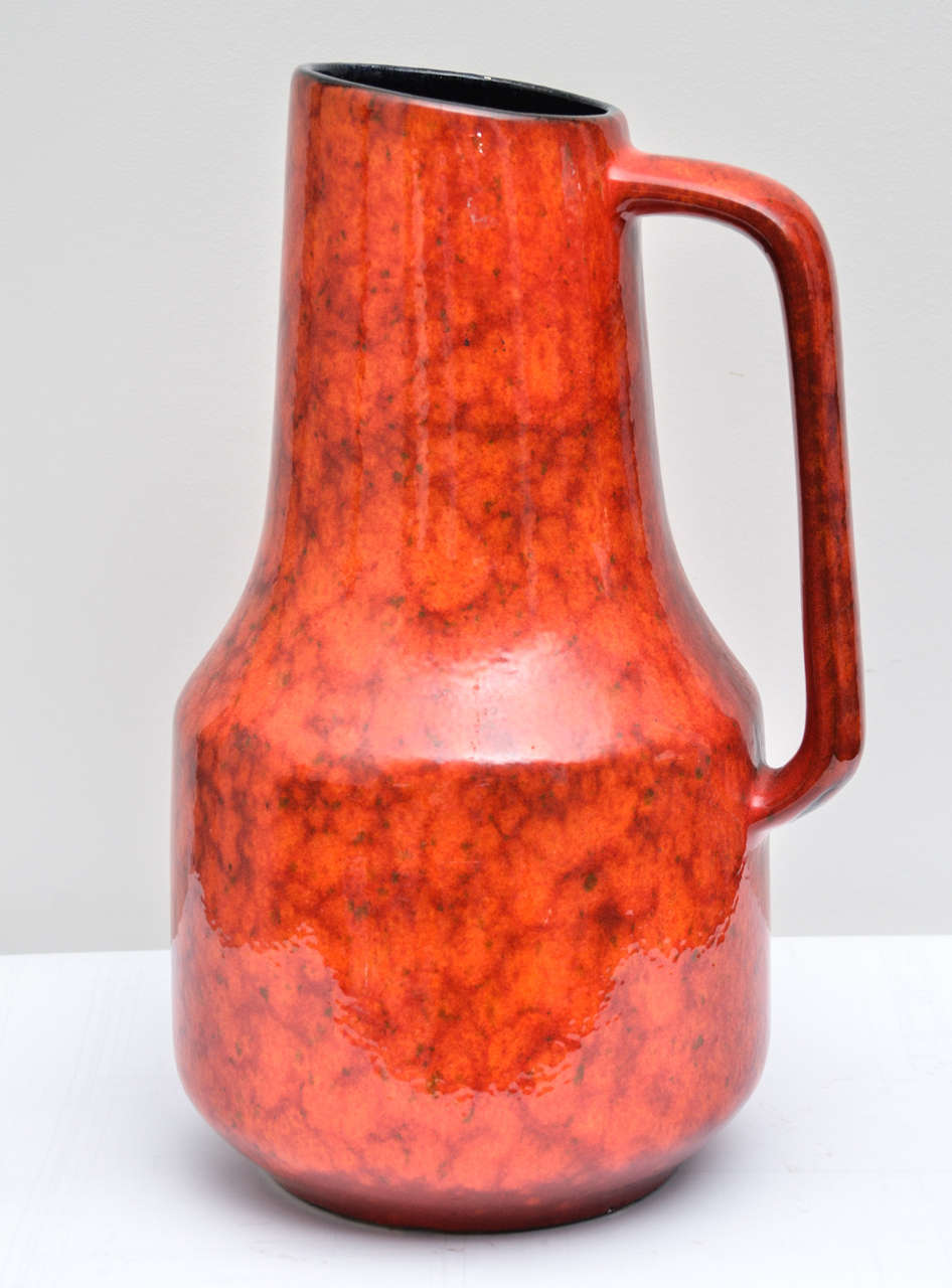 Bright Red Lava Glazed Pitcher with Black glazed interior from West Germany, this shape + size was Introduced by Scheurich Keramik in 1974.