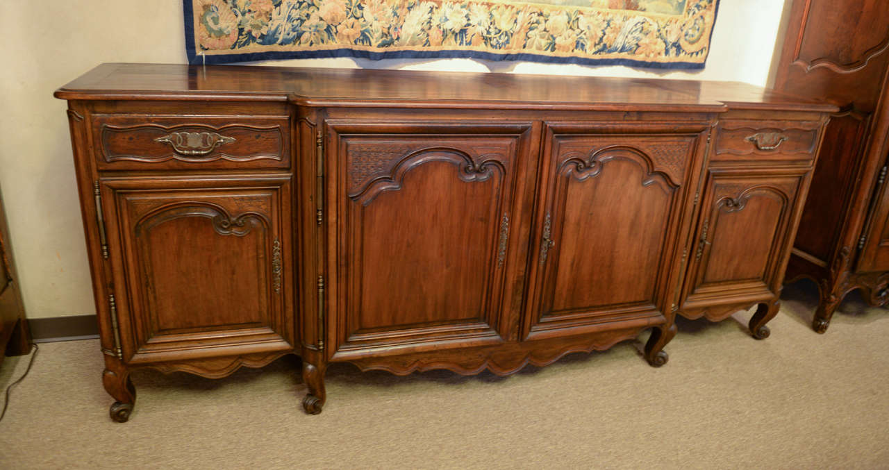 If you have a good long wall and would like a large space for serving or some good storage, this piece might be just right for you.  It is very well proportioned and the deep molding goes well with the heft of the body.  It has just enough carving