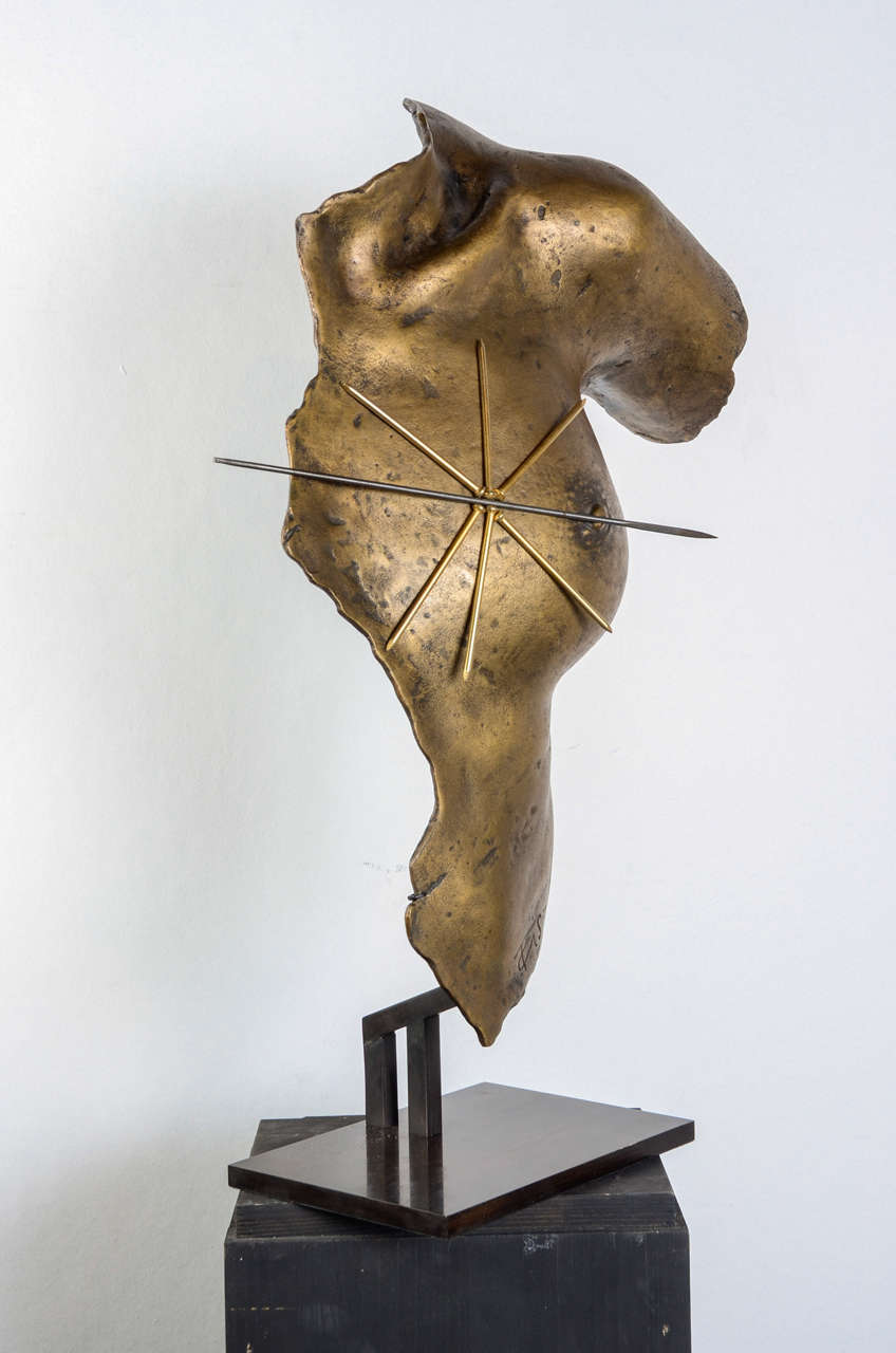 A gold bronze sculpture by Greek artist Takis with mobile magnetic gilt nails and a long needle. Signed and dated with a number 448 of the Artcurial edition of 1000. The sculpture has been mounted on a plith, but it also can be placed recumbent on a