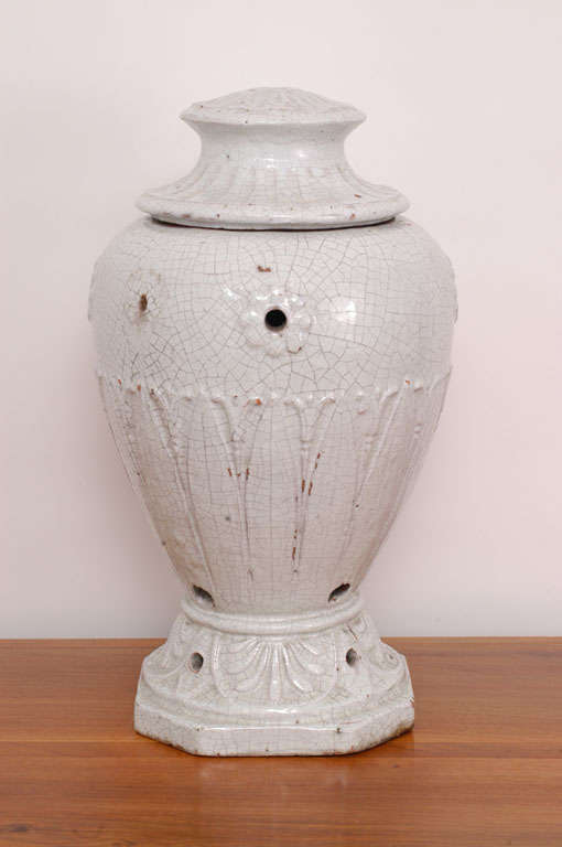A very rare hour-glass shape white faience Brassaro (Chauffage) with Feuille D' Eau decoration at the base.
