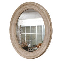 Greyis/white painted oval mirror