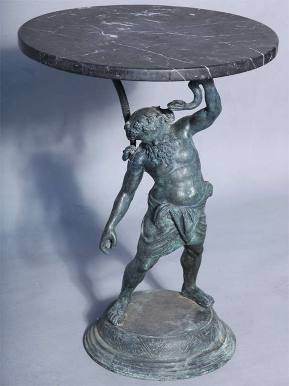 Accent table, having round marble top, its base formed as bronze statue of Bacchus standing on round foot.