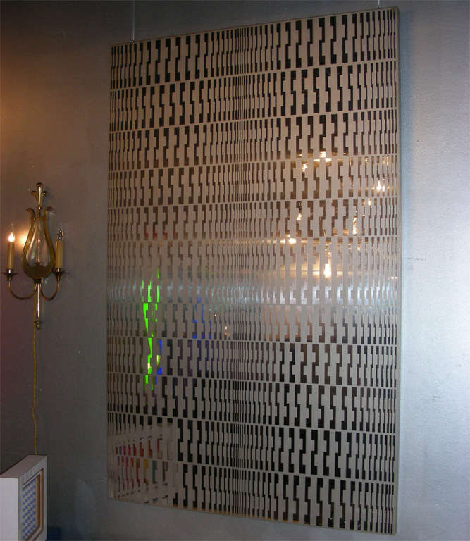 1960s kinetic decorative panel signed by Estuardo Maldonado and numbered 75 of 300, in stainless metal.