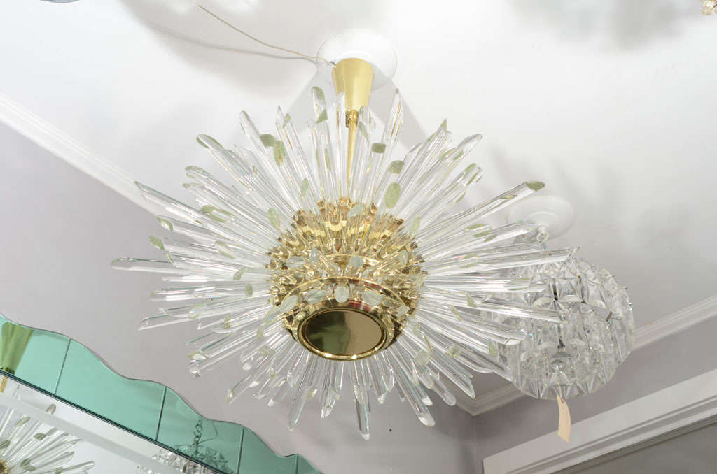Custom illuminating glass rod Sputnik chandelier in polished brass finish. Custom order are available for different sizes and finishes. Please specify the overall height you need for the chandelier upon order.