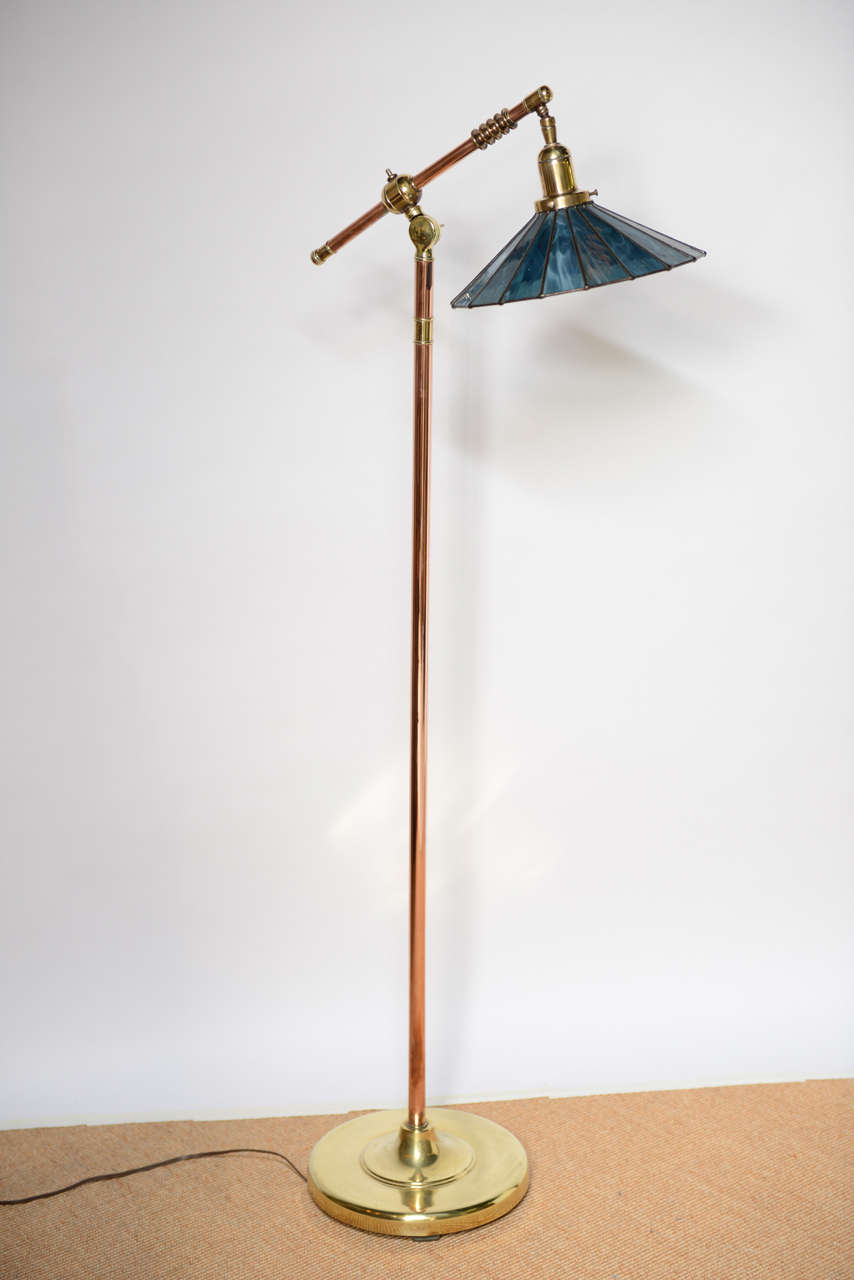Striking arts & crafts pharmacy lamp in brass and copper with exquisite blue leaded glass shade.  All original.